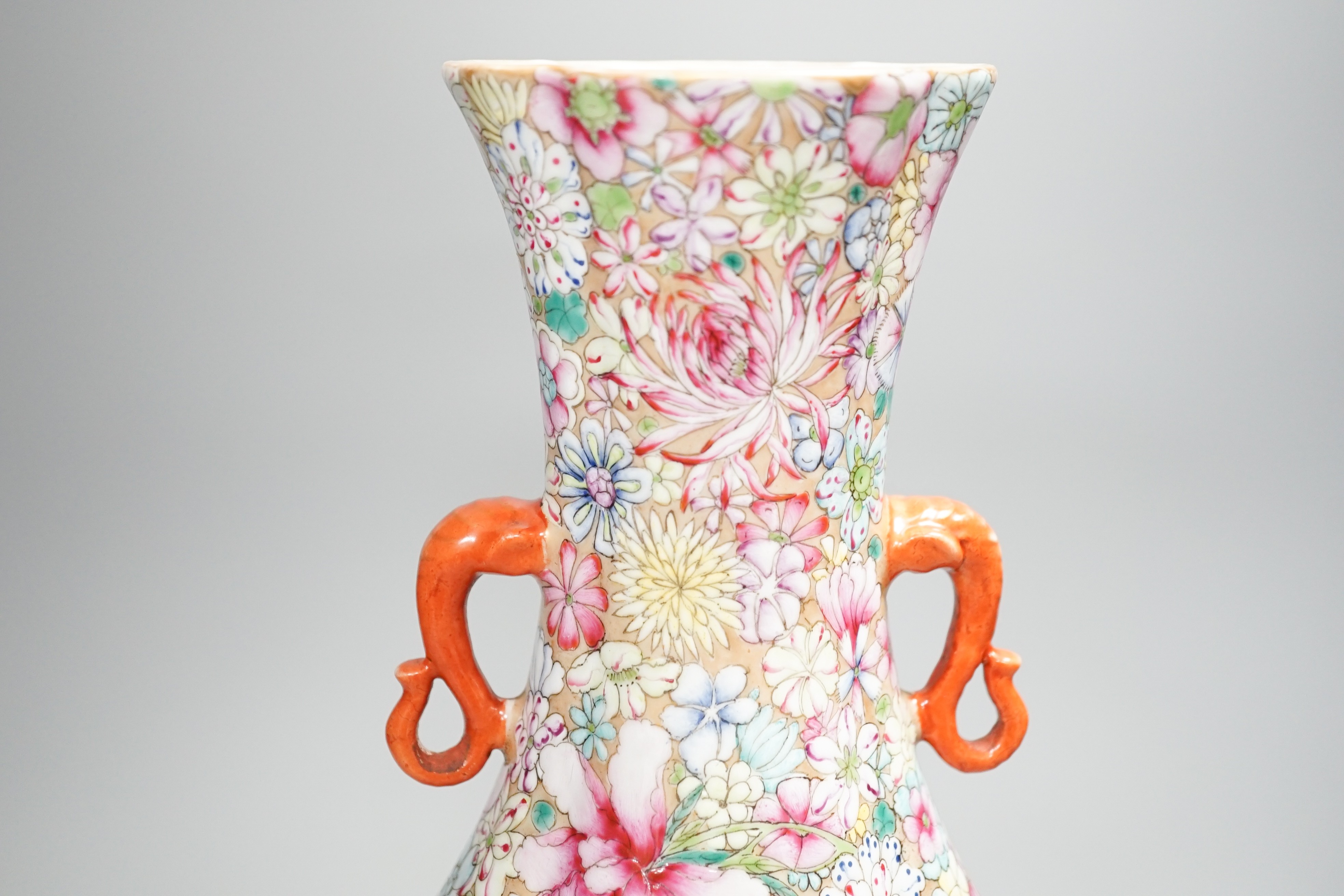 A Chinese famille rose millefleur 2 handled vase, 36cms high.